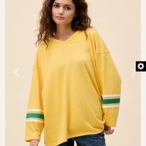 Daydreamer Yellow hockey jersey tee with green and white stripes on sleeves